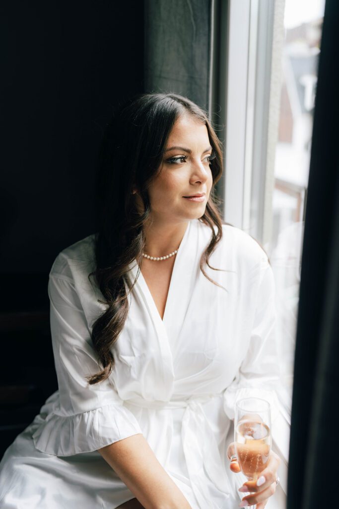 Bridal portrait holding wedding champagne